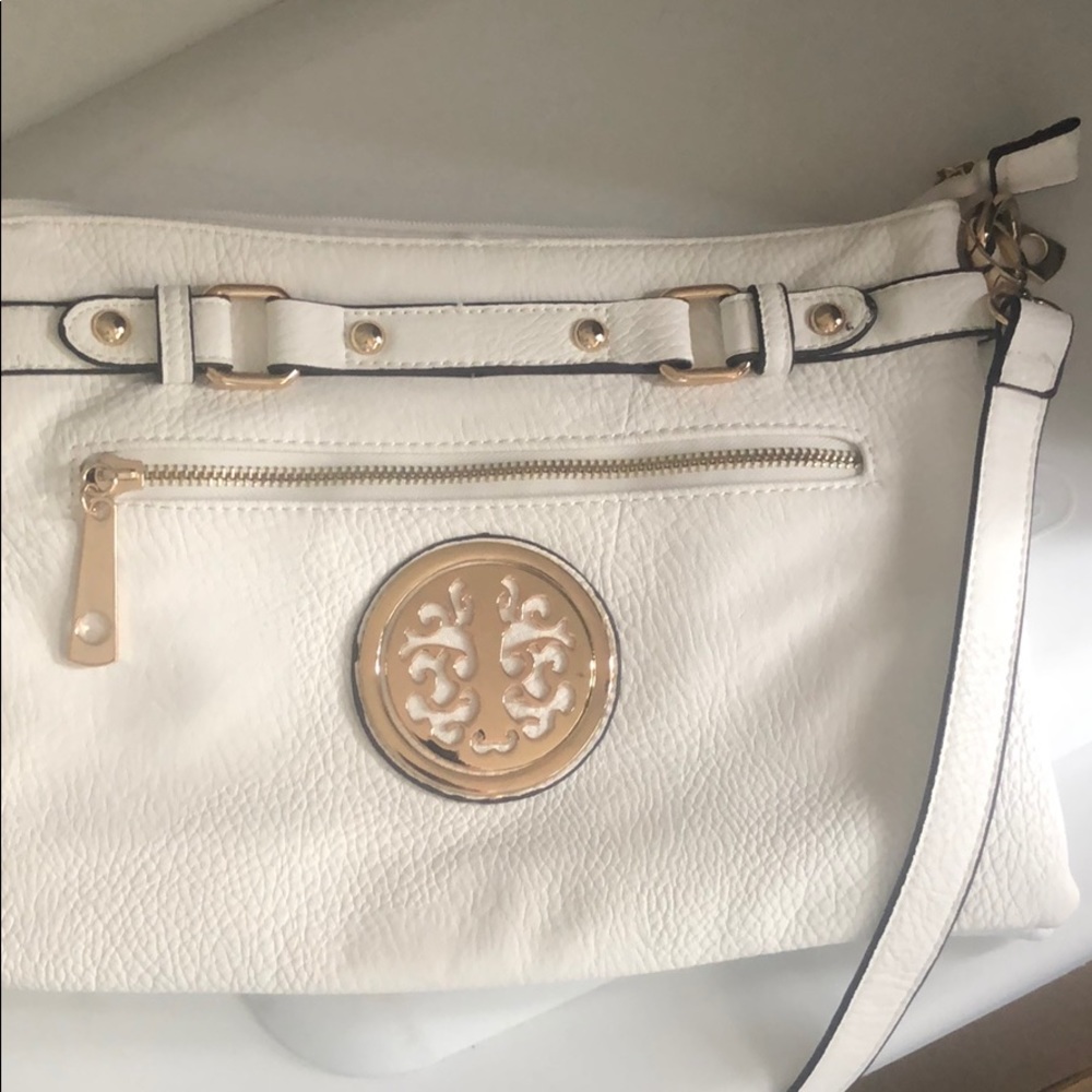 BNWOT white leather purse with gold emblem